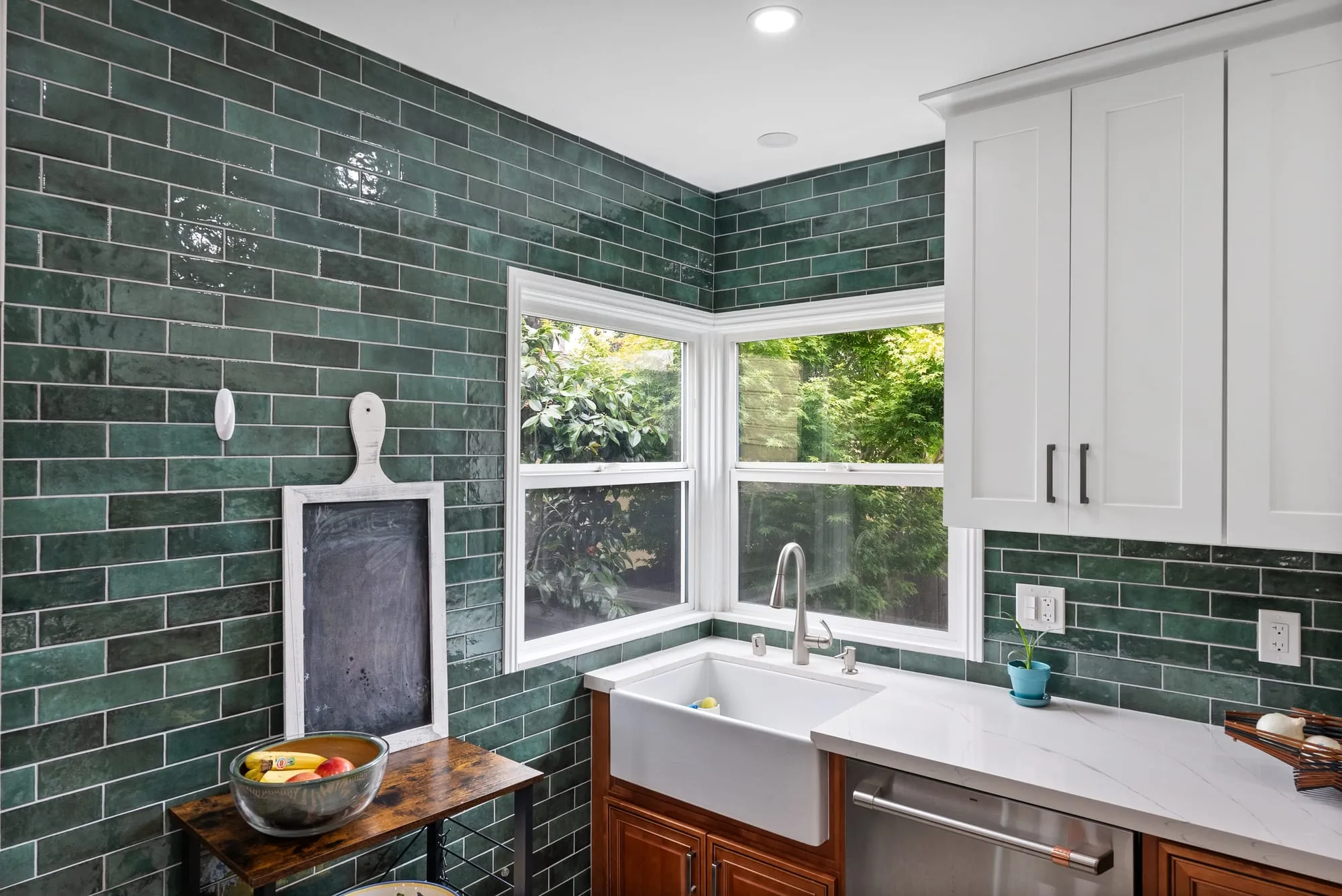 green tile and farmhouse sink