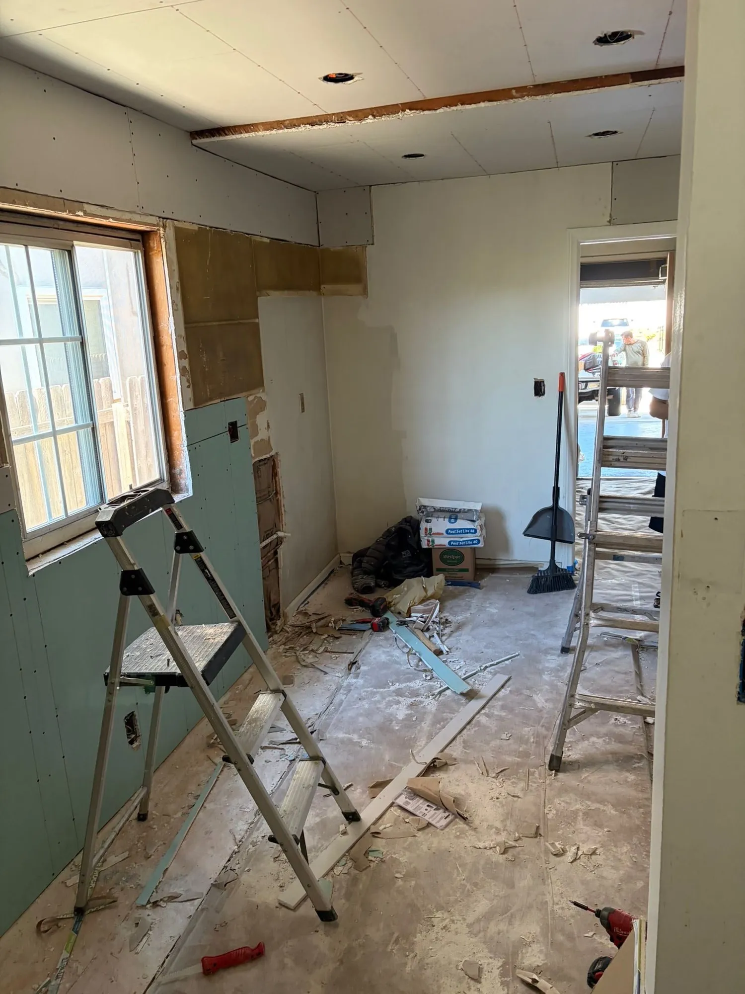 The same room stripped back during demolition, before the new kitchen went in