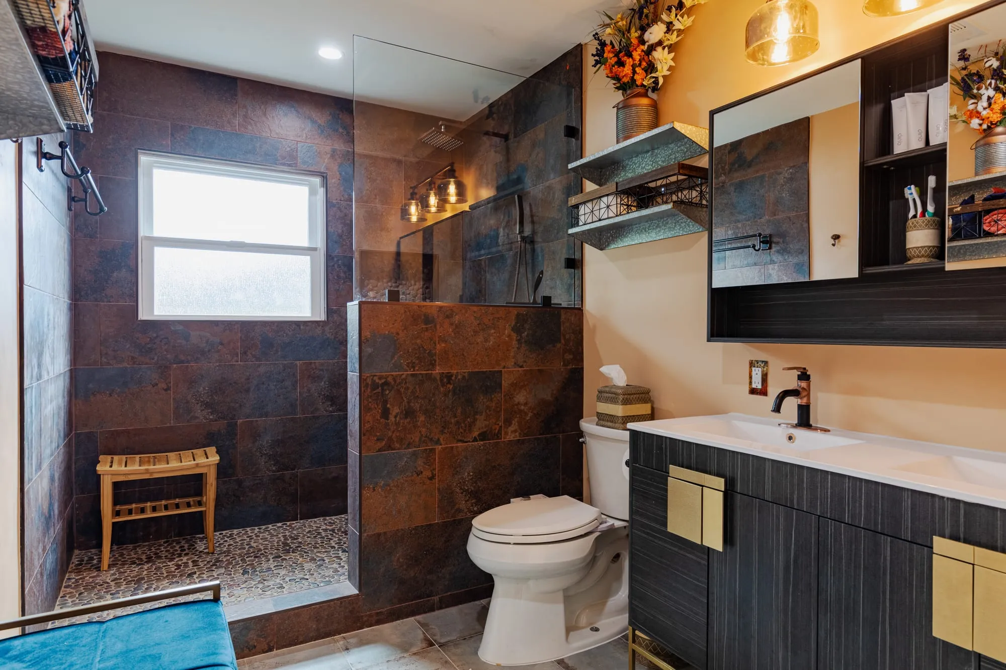 Wide view of the room from the shower to the vanity