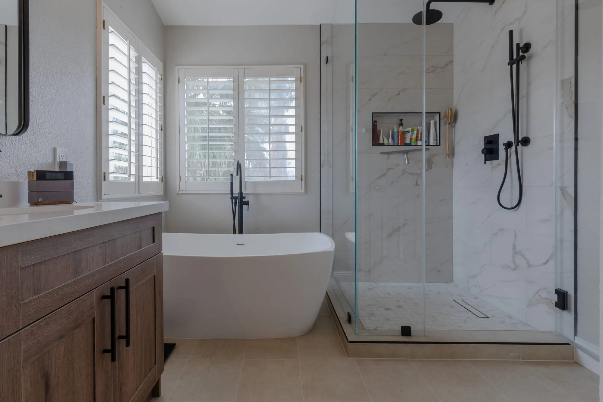 Freestanding tub and shower in the corner of the room