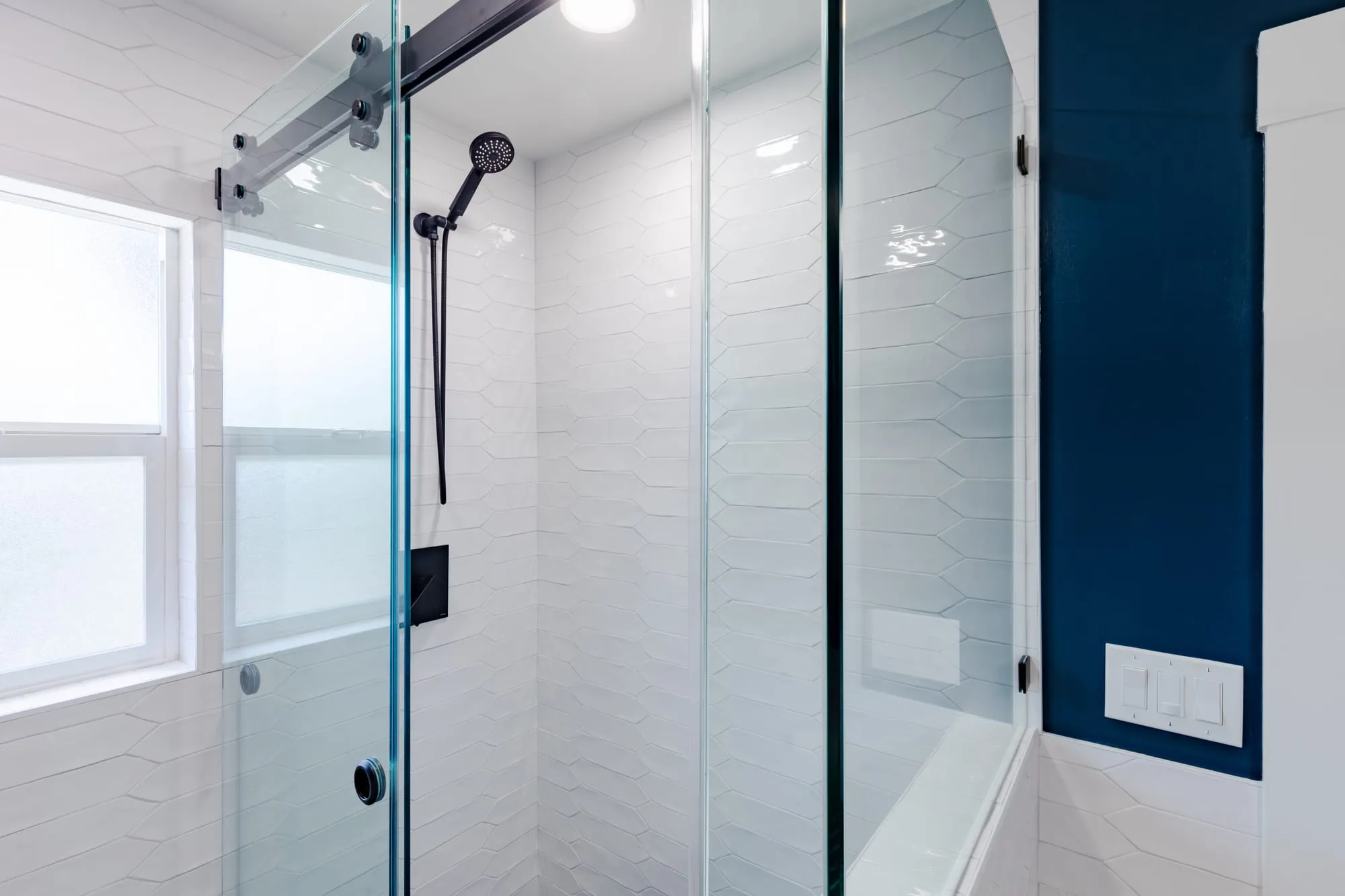 Shower and window with the navy wall above