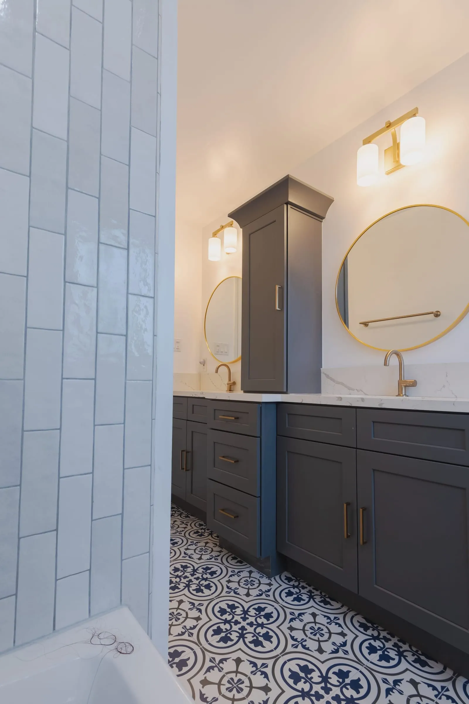 Vanity run with the round mirror and brass tap