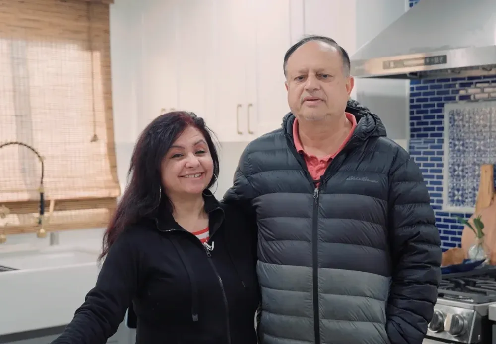 The homeowners — the blue-tile kitchen from this remodel